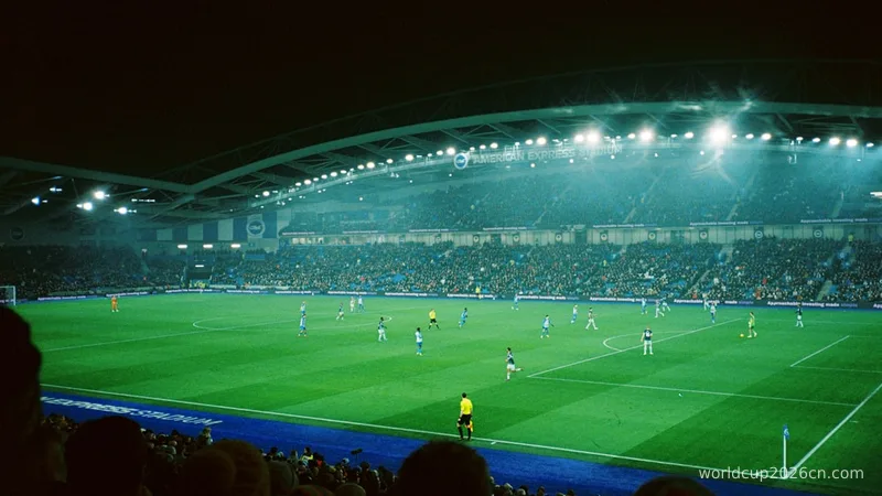 a soccer match in a stadium at night