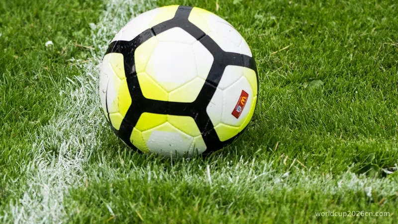 white and green soccer ball on green grass