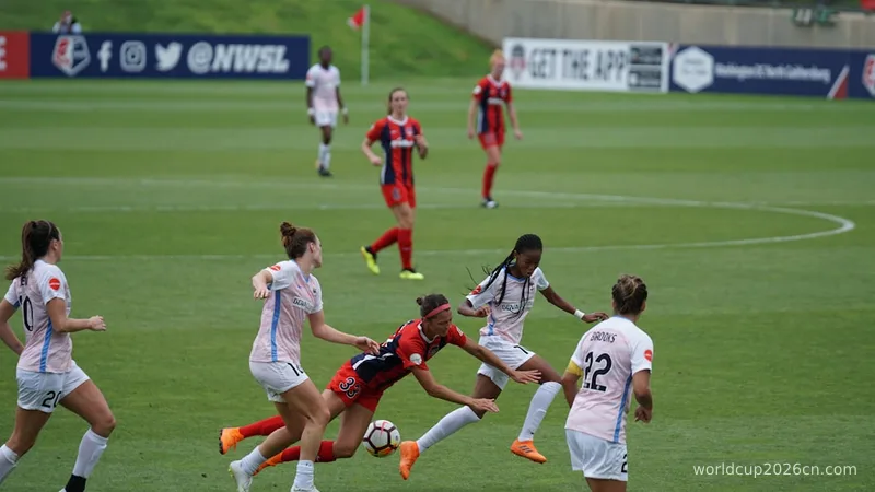woman playing soccer on field