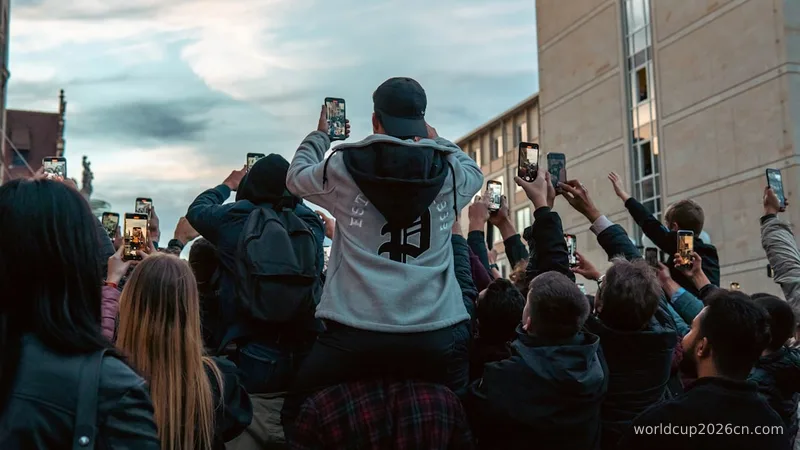 a group of people taking pictures with their cell phones