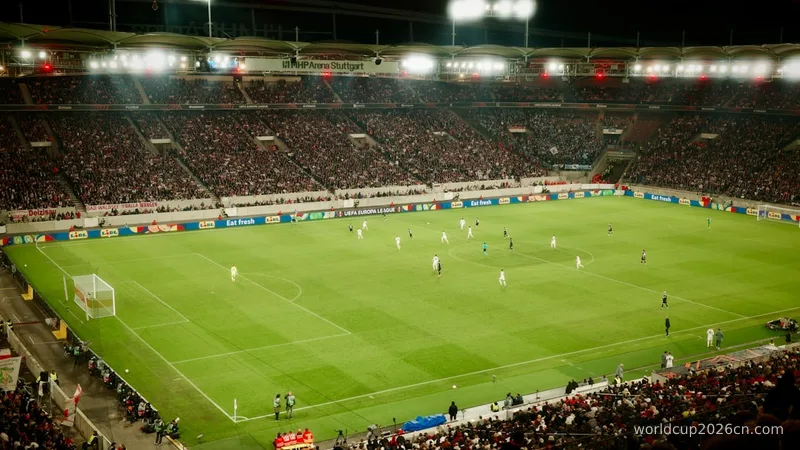 Soccer game played in a packed stadium at night