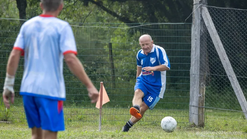 Man kicks soccer ball near goalpost during game