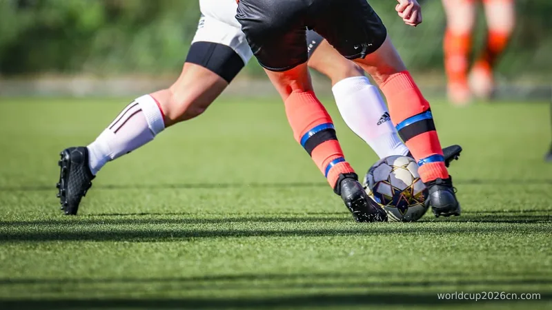 woman in black and white soccer jersey kicking soccer ball on green field during daytime