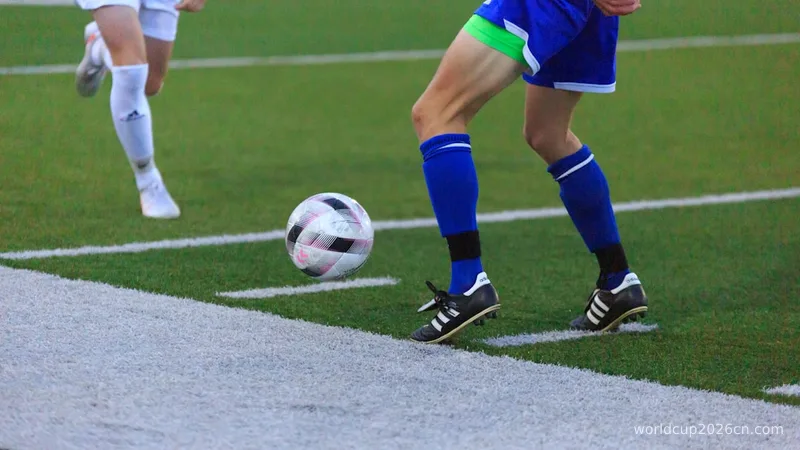person in blue and white soccer jersey kicking soccer ball on field during daytime