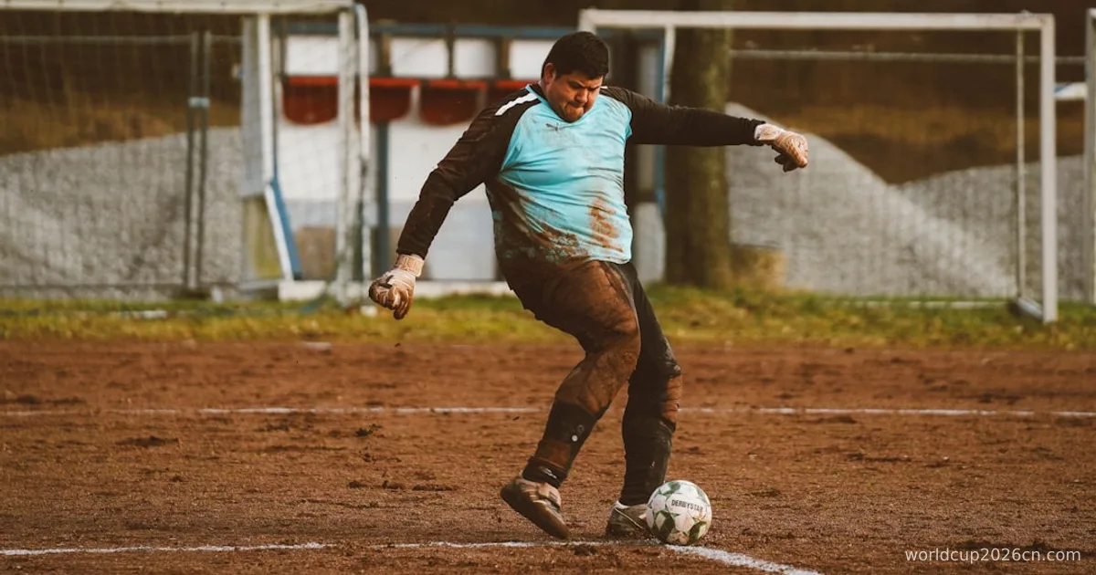 A man kicking a soccer ball across a field