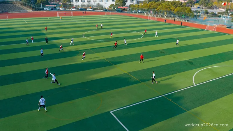 Soccer players on a green field during a game.