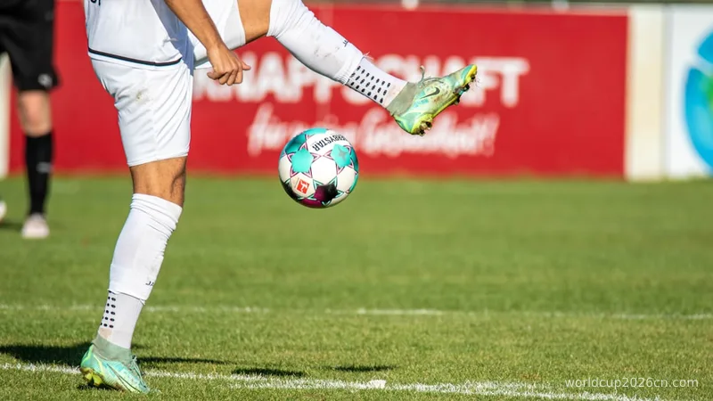 a man kicking a soccer ball on a field
