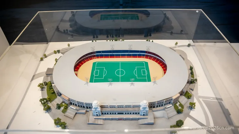 a model of a soccer stadium with a green field