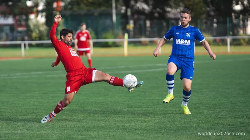 soccer players in red and blue jersey shirt and blue shorts
