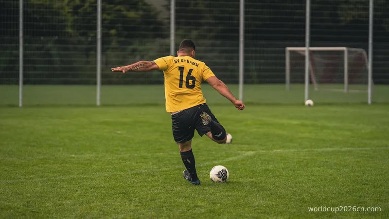 man in yellow and black soccer jersey kicking soccer ball on green grass field during daytime