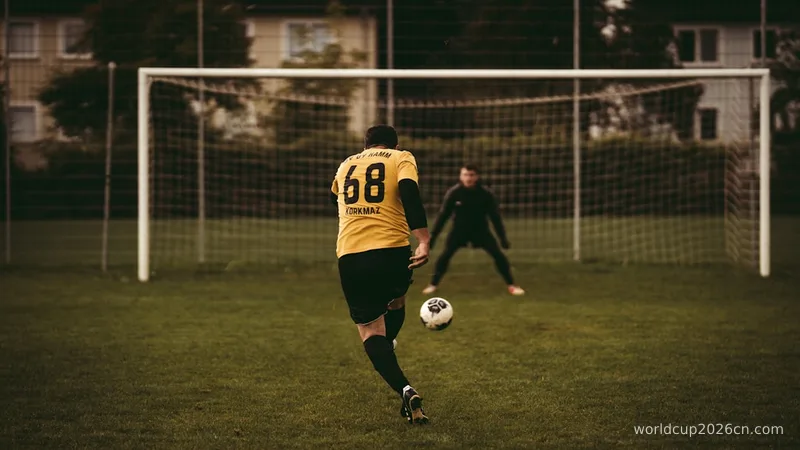 man in yellow and black soccer jersey kicking soccer ball on green grass field during daytime